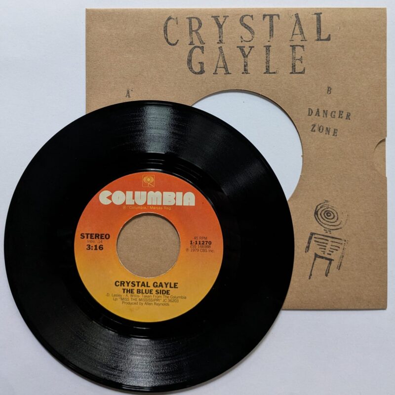 CRYSTAL GAYLE - THE BLUE SIDE / DANGER ZONE (1979) VINIL 7"