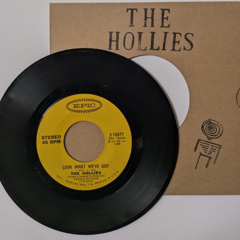 THE HOLLIES - LOOK WHAT WE'VE GOT / LONG COOL WOMAN (IN A BLACK DRESS) (1972) VINIL 7"